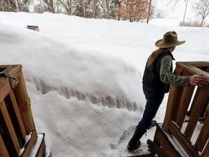 (Leah Hogsten | The Salt Lake Tribune)  Dan Harris of Eden walks around the snow bank just off his front porch, Mar. 6, 2023. Harris grows hay and Christmas trees on his 9-acre farm and is the president of Middle Fork Irrigation Co.