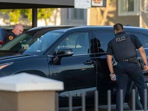 (Rick Egan | The Salt Lake Tribune) Salt Lake City Police look through car windows as they investigate a shooting at the Pebble Creek Apartments on 1700 South, where one person was killed and two were injured, on Monday, June 6, 2022.