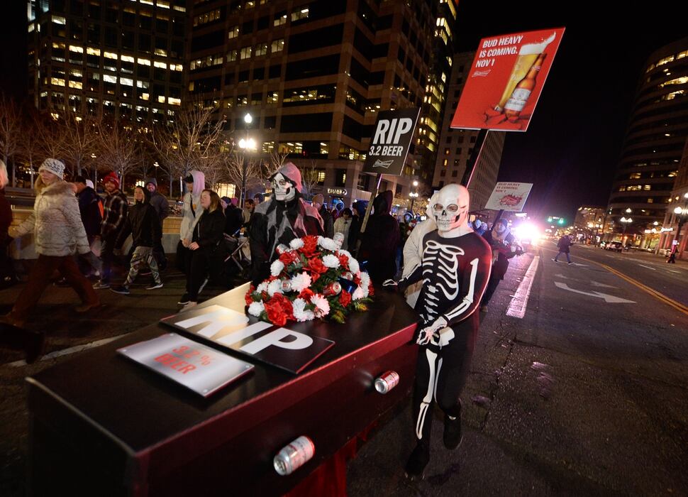 (Francisco Kjolseth | The Salt Lake Tribune) Budweiser’s iconic Clydesdales make a special trip to Utah to celebrate the changing beer laws in the state, joined by a “ghoulish group of pallbearers,” on Wed. Oct. 30, 2019, for a funeral procession for Utah’s last remaining 3.2 percent beer, on their way to Bar X, Beer Bar and Johnny’s on 200 South in Salt Lake City, as the state prepares to start selling 5 percent alcohol-by-volume in grocery and convenience stores starting Friday.