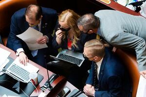 (Rick Egan | Tribune file photo) Representatives huddle during floor time in the Utah House on Feb. 26, 2021. Lawmakers rushed in the final days to finalize hundreds of bills before Friday's adjournment of the 45-day session that began in late January.