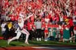 (Trent Nelson | The Salt Lake Tribune) Utah wide receiver Britain Covey (18) points to family in the stands after running a kick return for a touchdown against the Ohio State Buckeyes at the Rose Bowl in Pasadena, Calif., on Saturday, Jan. 1, 2022.