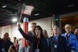 (Chris Samuels | The Salt Lake Tribune) Charlotte Bowerbank of Sandy waves an American flag after the playing of the National Anthem during the Utah Republican Party nominating convention on Saturday, April 23, 2022 in Sandy. Utah Republicans and Democrats will host there 2024 conventions this weekend.