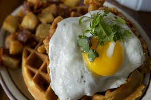 (Leah Hogsten |  Salt Lake Tribune file photo)  Chicken and waffles, with a fried egg on top, is a brunch menu item at the Hub & Spoke Diner in Salt Lake City.