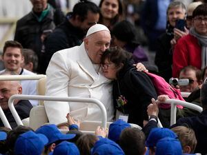 (Alessandra Tarantino | AP Photo) Pope Francis hugs a child at the end of his weekly general audience in St. Peter's Square, at the Vatican, Wednesday, March 29, 2023.