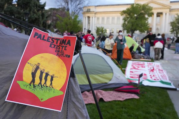 (Bethany Baker | The Salt Lake Tribune) A sign hangs from a tent during a pro-Palestine rally at the University of Utah in Salt Lake City on Monday, April 29, 2024.