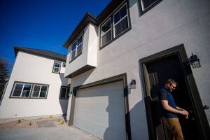 (Trent Nelson  |  The Salt Lake Tribune) Matt Stringham preapres to show the "Fonzi apartment" at a home at The Pines in Midvale on Wednesday, Dec. 1, 2021. The three homes that make up this Ivory Homes development in Midvale have secondary apartments, or accessory dwelling units (ADU).