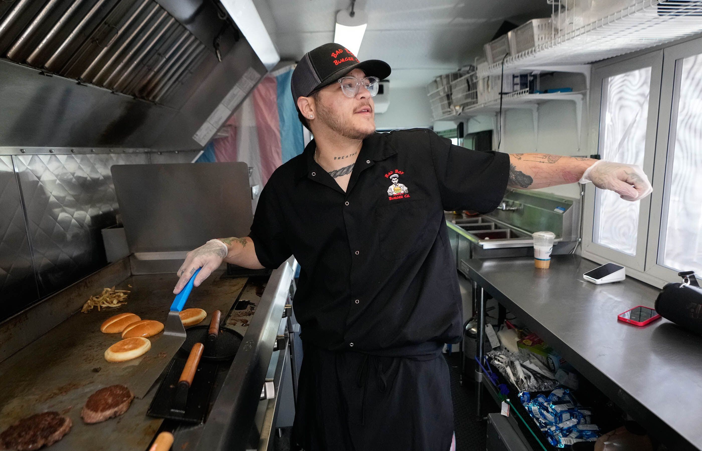 (Francisco Kjolseth  |  The Salt Lake Tribune) Jordan Starks, a trans man who operates his burger truck, Bad Boy Burger Co., prepares one of his signature mushroom burgers in Layton, on Tuesday, April 30, 2024. The Queer Food Feastival, set for May 10, is gathering food makers who are LGBTQ+ and allies.