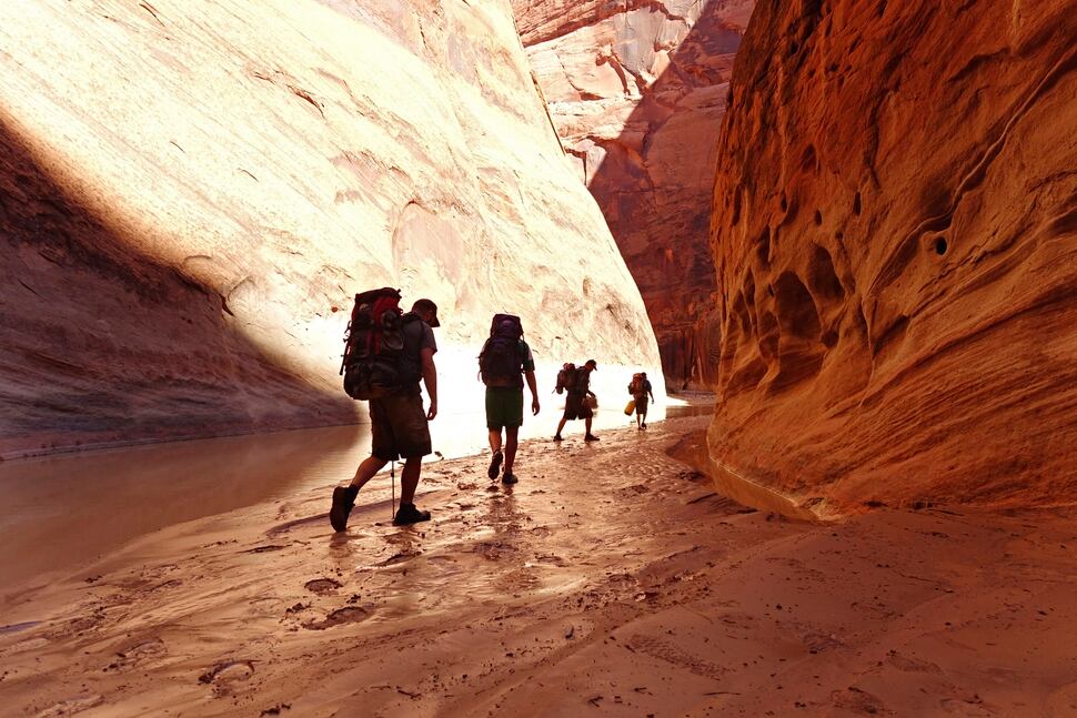 (Tribune File Photo) Hikers follow the silty Paria River on Monday, Sept. 26, 2016.