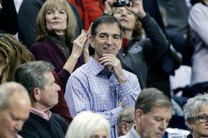 (Young Kwak | The Associated Press) Retired NBA player and Gonzaga alumnus John Stockton, center, looks on before an NCAA college basketball game in 2016 between Gonzaga and Washington in Spokane, Wash. Stockton can no longer attend his alma mater’s basketball games because he refuses to wear a mask.