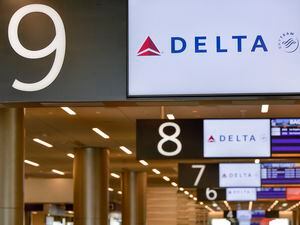 (Chris Samuels | The Salt Lake Tribune) Delta Air Lines signage at the baggage claim area in Salt Lake City International Airport, Wednesday, Oct. 12, 2022.