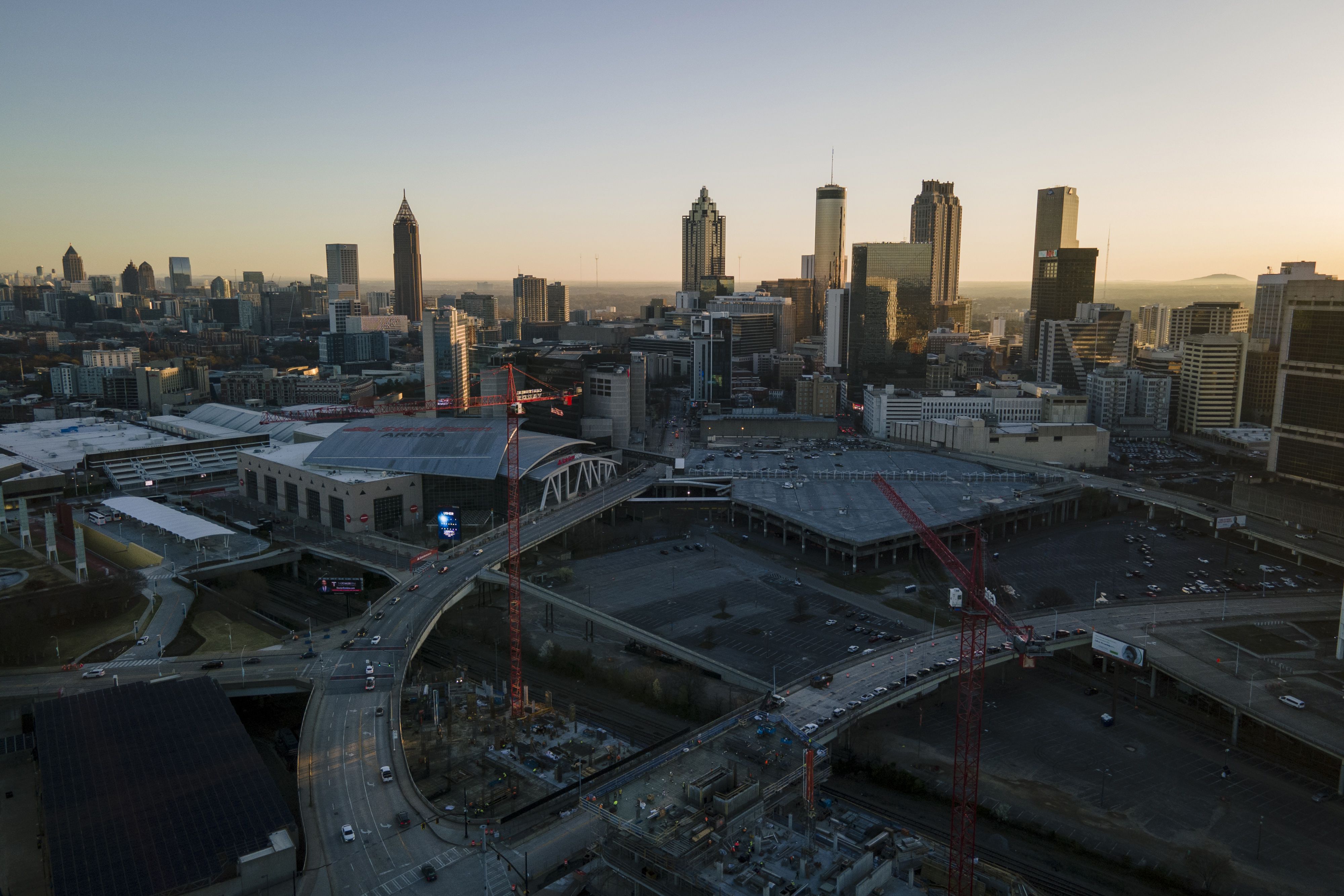 (Christian Monterrosa | The New York Times) The sun rises over downtown Atlanta, the capital of Georgia, March 12, 2024.