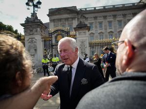 (Christophe Ena | AP) King Charles III greets mourners outside Buckingham Palace in London, Friday, Sept. 9, 2022. The king has been an outspoken advocate about the need to battle climate change for decades.