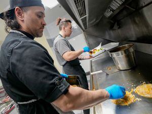 (Francisco Kjolseth | The Salt Lake Tribune) Spencer Langi, left, owner and executive chef of Café Limón prepares birria tacos alongside his son Villiami Langi at the restaurant in West Valley City on Thursday, Feb. 23, 2023. Langi is half Tongan but fell in love with Latin American food, offering a fusion of many cultures.