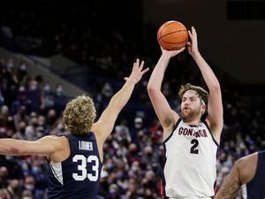 Gonzaga forward Drew Timme (2) shoots over BYU forward Caleb Lohner (33) during the second half of an NCAA college basketball game, Thursday, Jan. 13, 2022, in Spokane, Wash. Gonzaga won 110-84. (AP Photo/Young Kwak)
