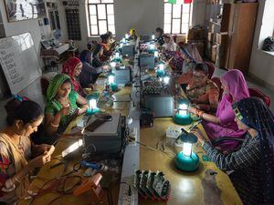 (Smita Sharma | The New York Times)

Women from villages near Tilonia, India learn how to make solar lamps at the Barefoot College, March 20, 2023.