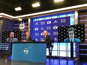 (Francisco Kjolseth | The Salt Lake Tribune) Brigham Young University athletic director Tom Holmoe, left, and president Kevin Worthen, are flanked on screens by Big 12 Conference commissioner Bob Bowlsby, left, and Texas Tech University president Lawrence Schovanec during a press conference in Provo announcing BYU's acceptance into the Big 12, Friday, Sept. 10, 2021.