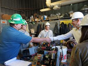 (Courtesy of Rep. John Curtis) Rep. John Curtis (right), R-Utah, shakes hands with an employee at Energy Fuels' White Mesa uranium mill in September 2019. Some $75 million for a reserve uranium was included in the massive spending bill passed by Congress this week.