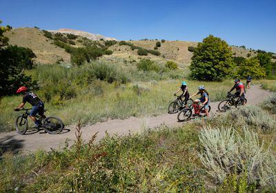 (Francisco Kjolseth | The Salt Lake Tribune) Mountain bikers enjoy a trail near Butterfield Canyon in August 2023. Even more trails are about to open in the area.