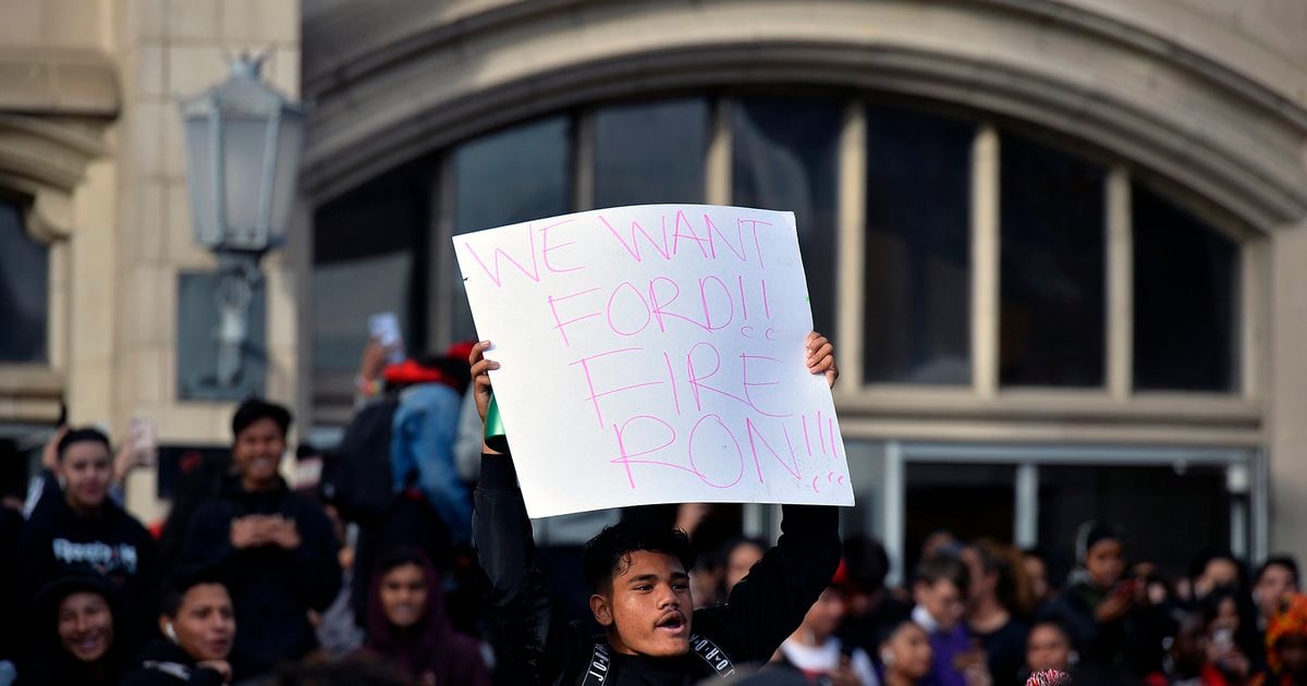 Students walk out of West High School after their principal is put on leave