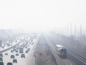 (Francisco Kjolseth | The Salt Lake Tribune) Inversion conditions deteriorate air quality near Farmington as the Frontrunner train and highway traffic move along the I-15 corridor on Friday Dec. 3, 2021. 