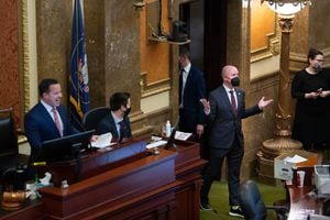 (Francisco Kjolseth  | The Salt Lake Tribune) Gov. Spencer Cox steps into the House chamber following Rep. Francis Gibson, R-Mapleton, motion Friday night that the Legislature hear from “Gov. Gary Herbert.” House Speaker Brad Wilson noted that the motion paper apparently had the name of the former executive branch leader, a mix up that drew laughter from the body. at the Capitol in Salt Lake City on Friday, March 5, 2021, during the final day of the Utah Legislature’s 2021 general session.