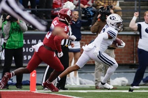 BYU defensive back Malik Moore, right, runs the interception he caught on a pass intended for Washington State wide receiver Donovan Ollie (6) out of the end zone during the first half of an NCAA college football game, Saturday, Oct. 23, 2021, in Pullman, Wash. (AP Photo/Young Kwak)