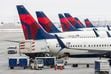 (Rick Egan | The Salt Lake Tribune) Delta Air Lines planes at Salt Lake City International Airport, on Friday, Dec. 23, 2022.