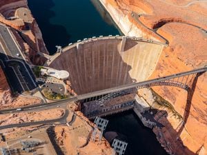 (Ecoflight) An aerial view of the Glen Canyon Dam at Lake Powell, Thursday, April 14, 2022.