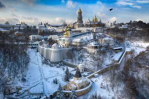 (Efrem Lukatsky | The Associated Press)A bird flies near the 1,000-year old Orthodox Monastery of Caves covered with the first snow of this winter in Kyiv, Ukraine, Friday, Jan. 15, 2021. The Church of Jesus Christ of Latter-day Saints is moving its missionaries out of the country as Ukraine's tensions with Russia rise.
