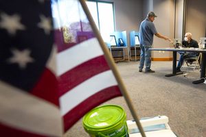 (Leah Hogsten | The Salt Lake Tribune) William Proger, left, gets ready to cast his ballot Nov. 2, 2021, at Sandy City Hall.