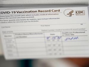 (Wilfredo Lee | AP) CDC coronavirus COVID-19 vaccination cards. A Midvale plastic surgeon and four others were indicted Jan. 11 for allegedly providing fraudulent vaccine cards to individuals who did not receive vaccine doses.