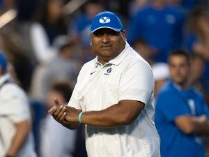 (Rick Egan | The Salt Lake Tribune) Brigham Young Cougars head coach Kalani Sitake takes the field before football action between the Brigham Young Cougars and the Baylor Bearsat LaVell Edwards Stadium in Provo, on Saturday, Sept. 10, 2022.