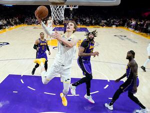 Utah Jazz forward Lauri Markkanen scores against the Los Angeles Lakers during the second half of an NBA basketball game Friday, Nov. 4, 2022, in Los Angeles. (AP Photo/Marcio Jose Sanchez)