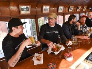 (Francisco Kjolseth  |  The Salt Lake Tribune) Trolley Wing Co. co-owners Jeff Krie, left, and Jesse Wilkerson are photographed in 2019 in the bar's namesake trolley car location, which they had to close this week so they could transfer its liquor license to another location.
