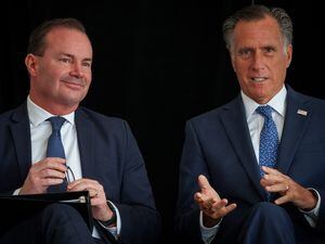 (Trent Nelson  |  The Salt Lake Tribune) Senators Mike Lee and Mitt Romney at the ribbon cutting ceremony for Thermo Fisher Scientific's Ogden facility on Wednesday, April 20, 2022.