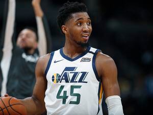 FILE - In this Jan. 30, 2020, file photo, Utah Jazz guard Donovan Mitchell looks to the bench for direction in the second half of an NBA basketball game against the Denver Nuggets in Denver. (AP Photo/David Zalubowski, File)