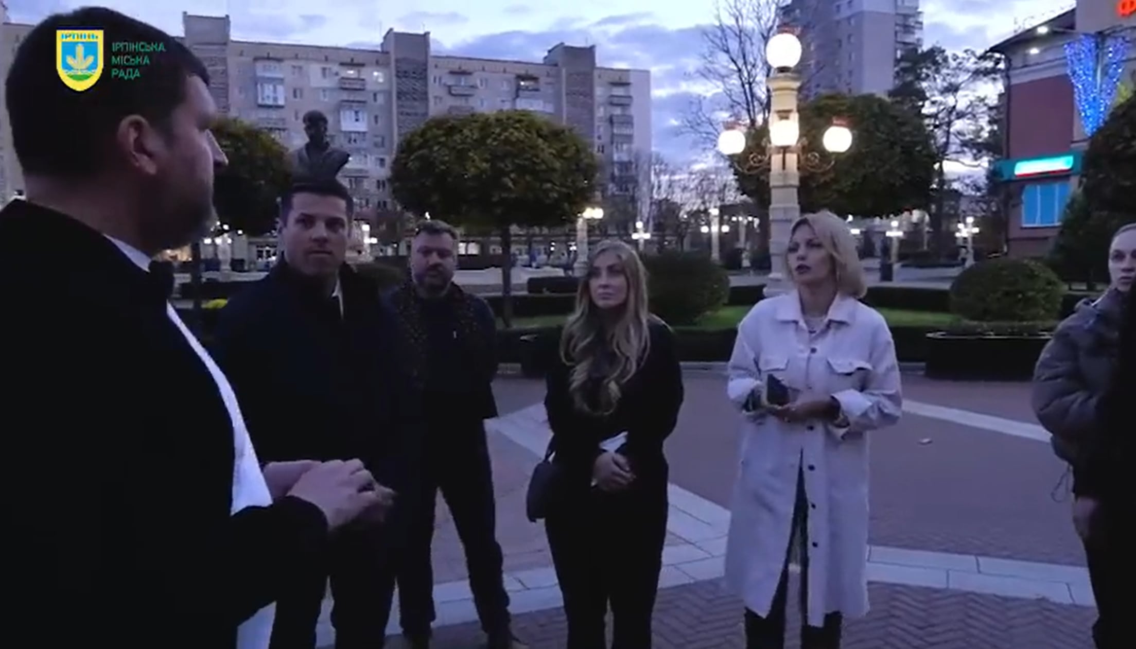 (Screen capture) Vineyard City Mayor Julie Fullmer, seen wearing dark clothes in the center of this screen capture from a promotional video, tours Irpin, Ukraine, sometime in late 2023.