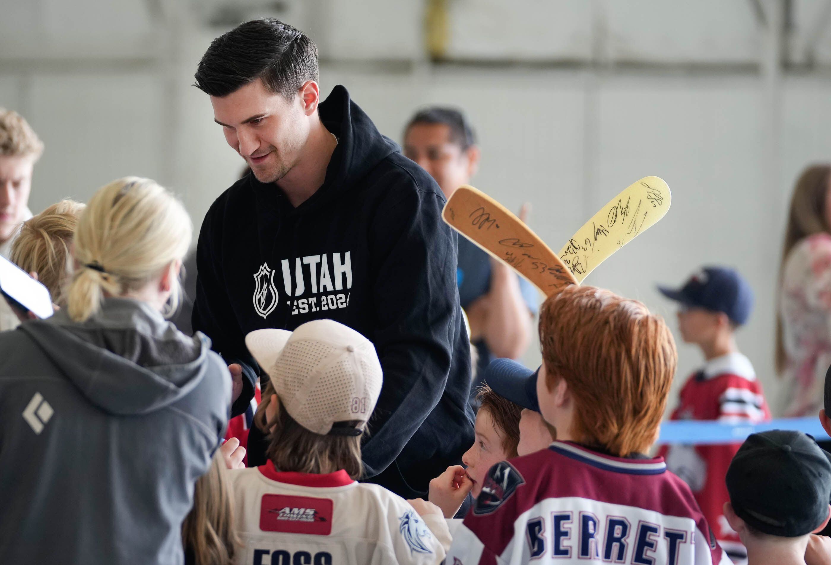 (Francisco Kjolseth  |  The Salt Lake Tribune) Hockey player Josh Brown signs autographs for young NHL fans as they state’s new team arrival is welcomed by Utah fans on Wednesday, April 24, 2024.