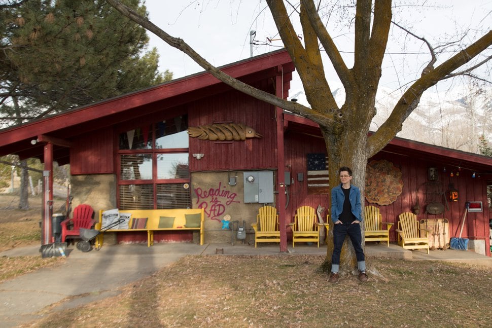 (Photo courtesy of Cat Palmer) Nicole LaRue stands outside the barn in Layton where she works as the art director for publisher Gibbs Smith.
