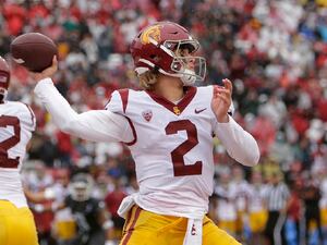 Southern California quarterback Jaxson Dart throws a pass during the first half of an NCAA college football game against Washington State, Saturday, Sept. 18, 2021, in Pullman, Wash. (AP Photo/Young Kwak)