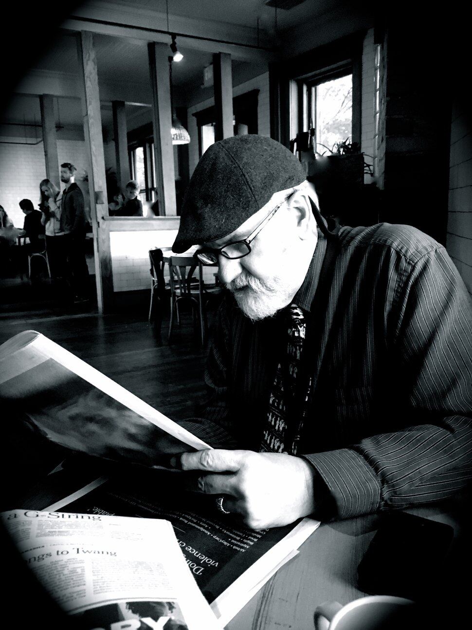 George Pyle, reading The New York Times at The Rose Establishment.