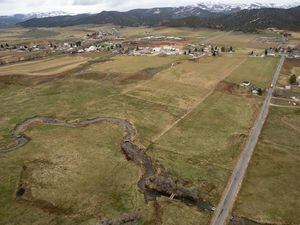 (Trent Nelson  |  The Salt Lake Tribune) Creamery Lane cuts through land that is set to be developed in Hoytsville on Tuesday, April 25, 2023.