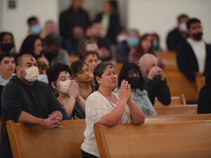 (Rachel Rydalch | The Salt Lake Tribune) A woman prays at Catholic Mass on Ash Wednesday at St. Joseph the Worker Catholic Church in West Jordan in 2022. A new survey shows 61% of Americans pray.