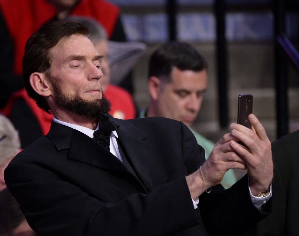 (Leah Hogsten | The Salt Lake Tribune) U.S. Senate candidate Abe Lincoln Brian Jenkins videos the rigorous debate on bylaws, amendment proposals and rules at the Utah Republican Nominating Convention Saturday, April 21, 2018 at the Maverik Center. 