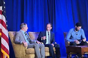 (Jacob Scholl | The Salt Lake Tribune)  Reps. Chris Stewart and John Curtis share a stage with Enes Kanter Freedom at the Stewart Security Summit in Salt Lake City on Aug. 5, 2022.