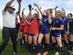 (Leah Hogsten | The Salt Lake Tribune) Skyline head coach Yamil Castillo celebrates with his players after the Eagles defeated Lehi High School, 3-1 to win the 5A Championship title Oct. 22, 2021 at Rio Tinto Stadium. 