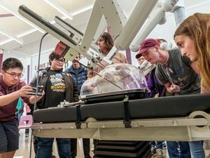 (Leah Hogsten | The Salt Lake Tribune) Lone Peak High School students got to try their hand at robotic assisted surgery with the da Vinci XI robot, Monday, April 18, 2022.