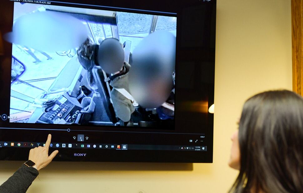 Leah Hogsten | The Salt Lake Tribune Brenda Mayes, right, watches a 20 second video of her son getting dragged by a school bus after the bus doors were shut on the boysÕ backpack, pinning him in midair. Mayes filed a lawsuit, Tuesday, May 7, 2019 against the Davis School District, accusing a bus driver of racial discrimination against her son.