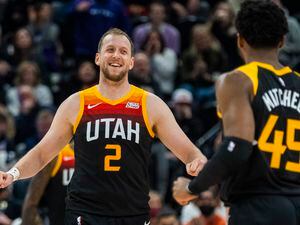 (Rick Egan | The Salt Lake Tribune) Utah Jazz guard Joe Ingles (2) celebrates with Donovan Mitchell (45) after Mitchell hit a big shot for the Jazz with 2:50 remaining the the game, in NBA action between the Utah Jazz and the Washington Wizards, at Vivint Arena on Saturday, Dec. 18, 2021.