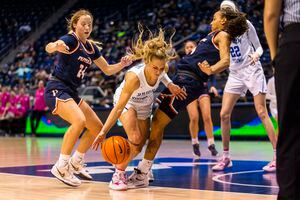 (Rick Egan | The Salt Lake Tribune) BYU guard Paisley Harding (13), Collins with Pepperdine Waves guard Jayla Ruffus-Milner (14), in women's basketball action between the BYU Cougars and the Pepperdine Waves, at the Marriott Center in Provo, on Thursday, Feb. 10, 2022. Judkins scored his 450th win tonight.